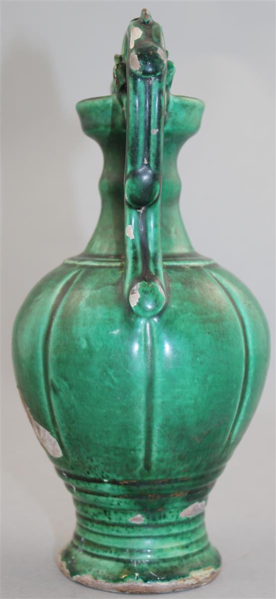 A Chinese green glazed pottery twin handled vase, in Tang style, 20.5cm.